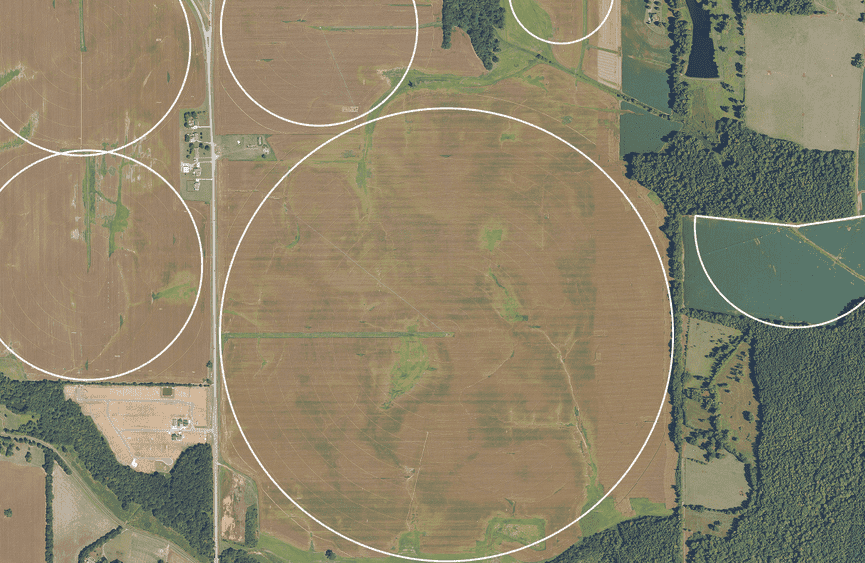 Aerial imagery of standard center pivot irrigation systems in North Alabama, with circular irrigation patterns visible across agricultural fields.