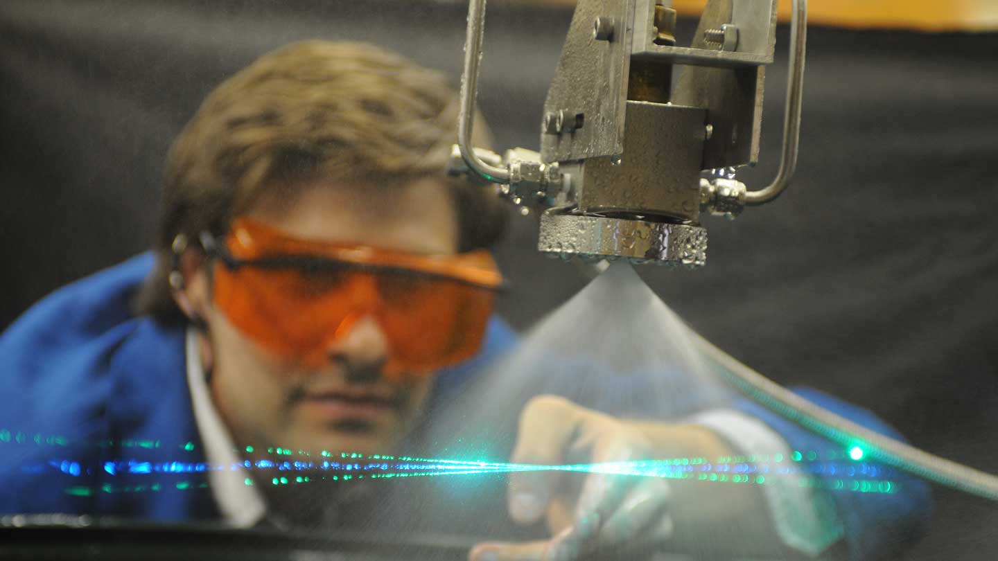 a man uses a laser device