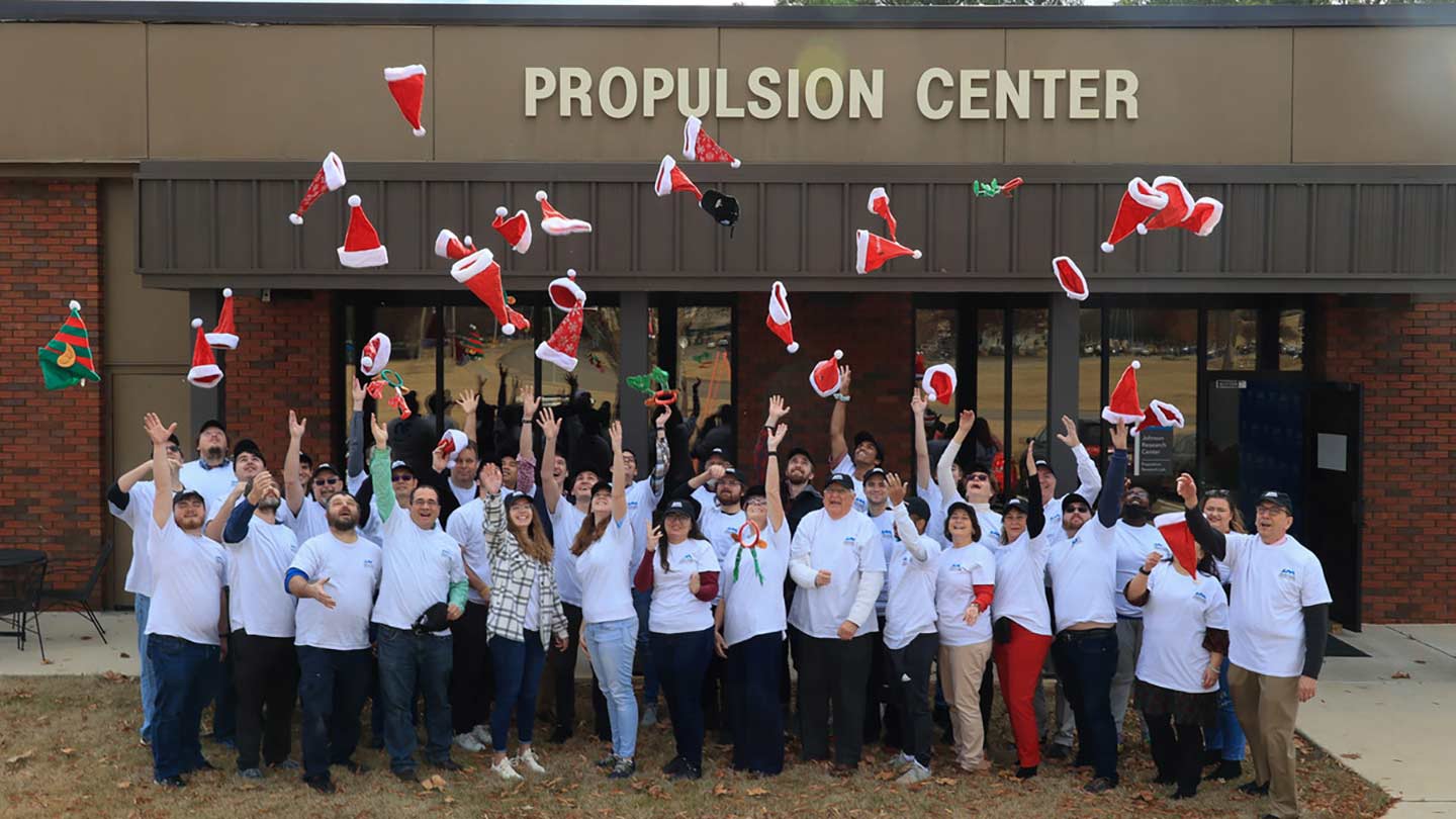 photo of fall 2022 prc graduates standing in front of the propulsion center building