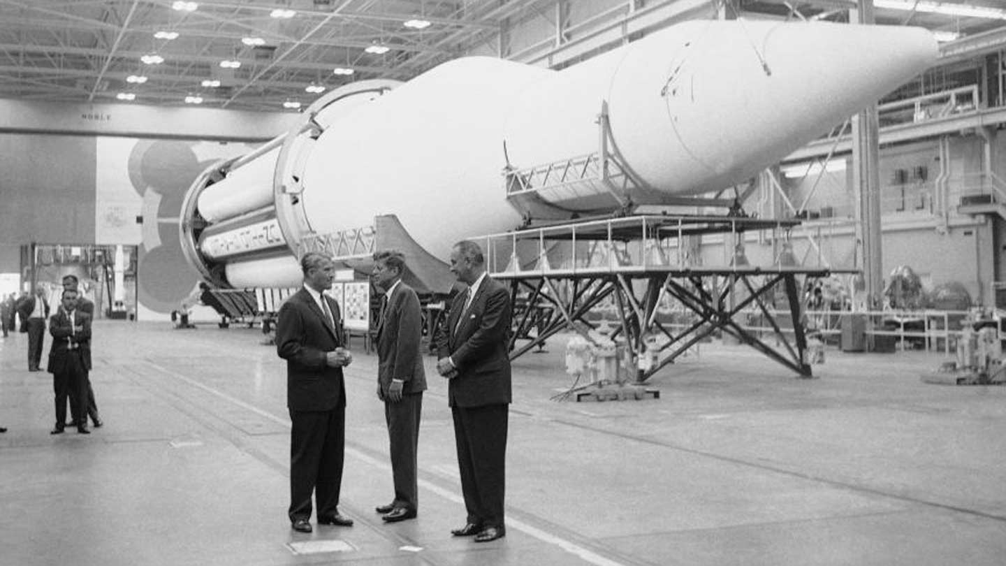 Wernher von Braun, Kennedy, & Johnson standing by rocket.