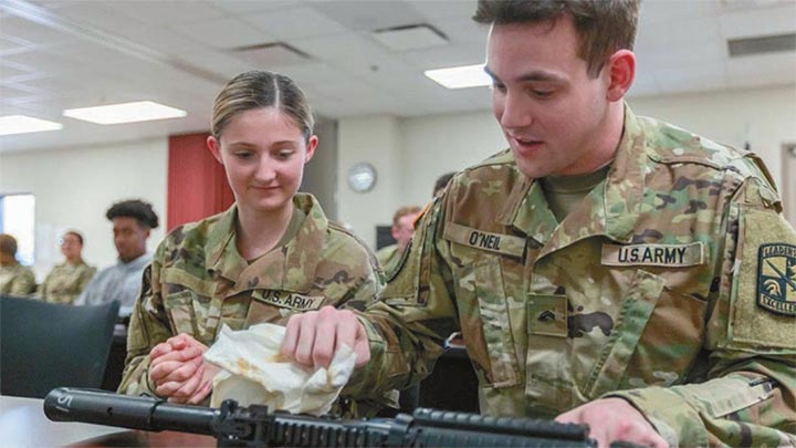 2023 cadets clean a rifle